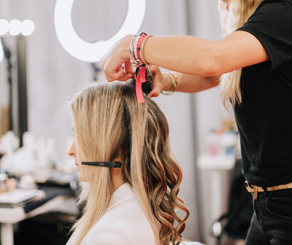 Hair stylist with a client in a salon