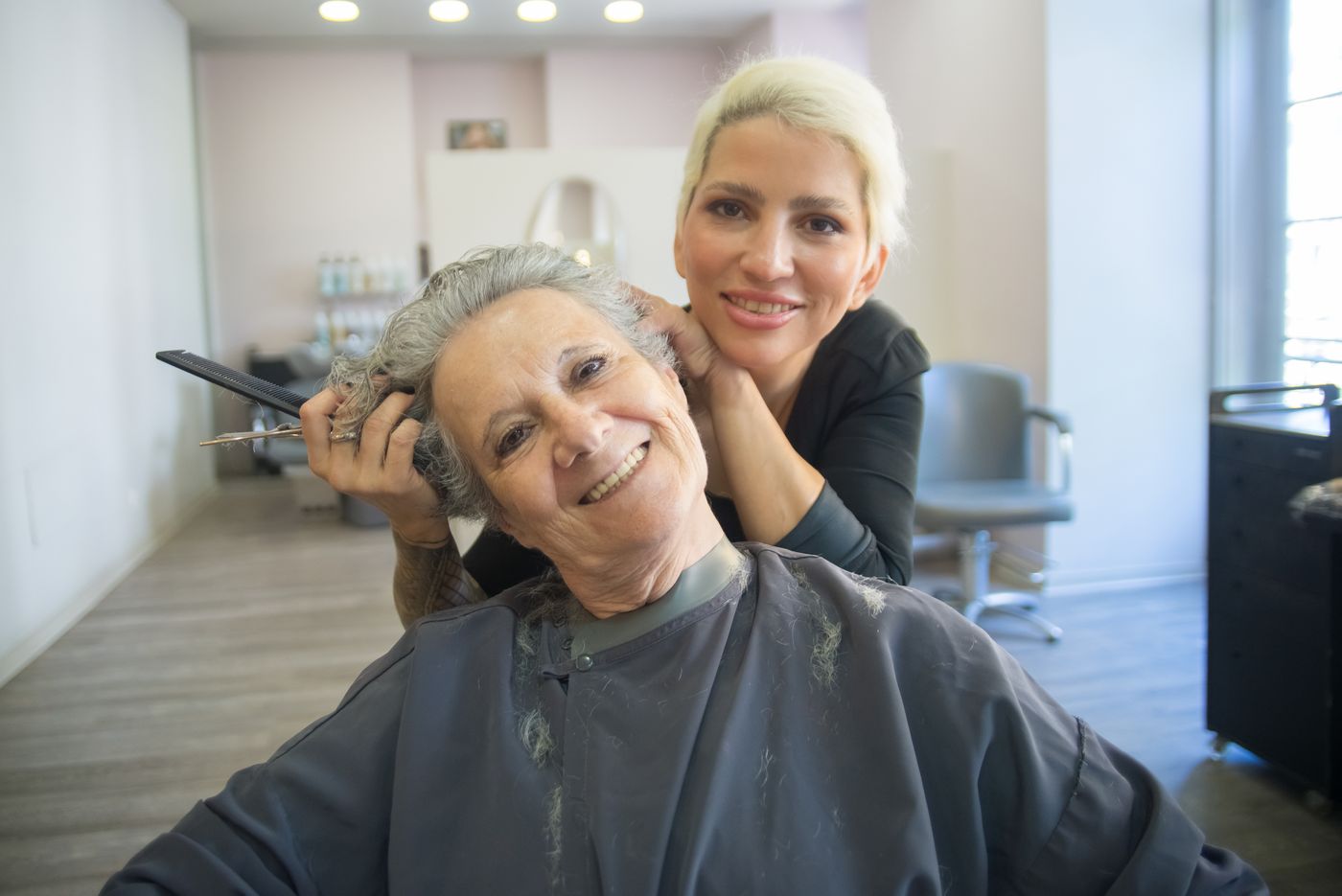 Salon owner with a client in her studio